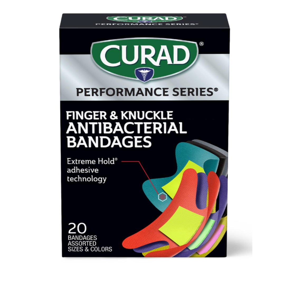 A box of Medline CURAD Performance Series Antibacterial Bandages with 20 assorted finger and knuckle bandages in various sizes and colors, featuring Extreme Hold adhesive technology on the packaging.